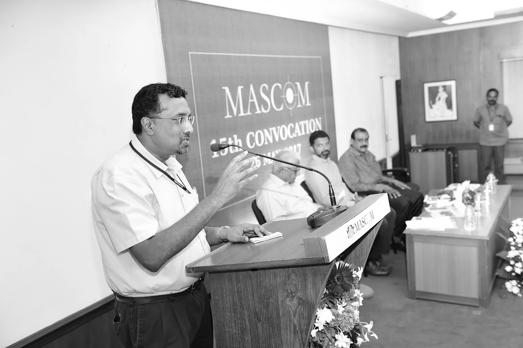 Ravi addressing a MASCOM convocation from the lectern